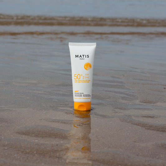 sun protection cream container sand